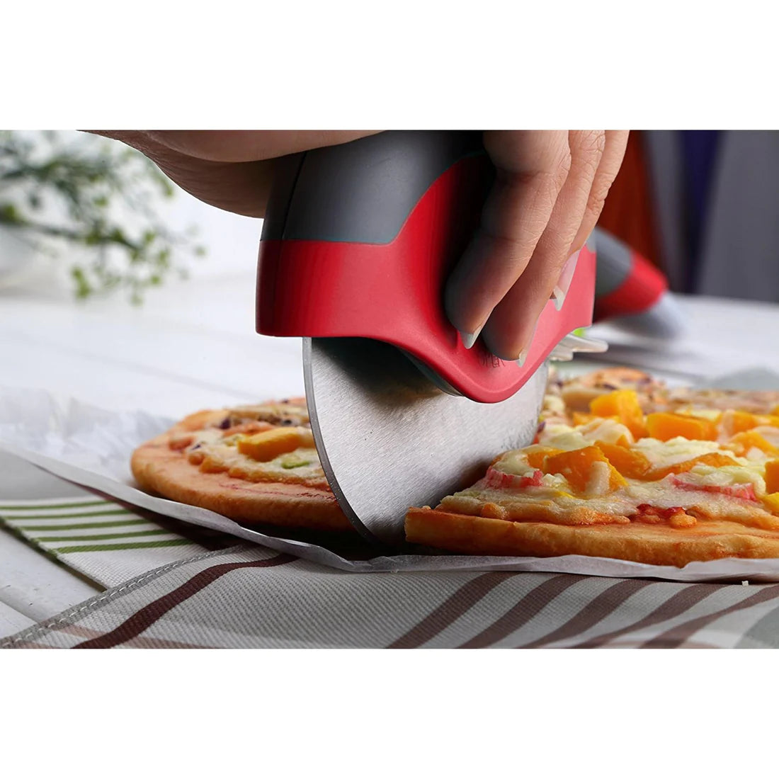 Pizza Cutter With Removable Safety Shield In Use